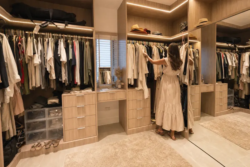 A lit walk-in wardrobe
