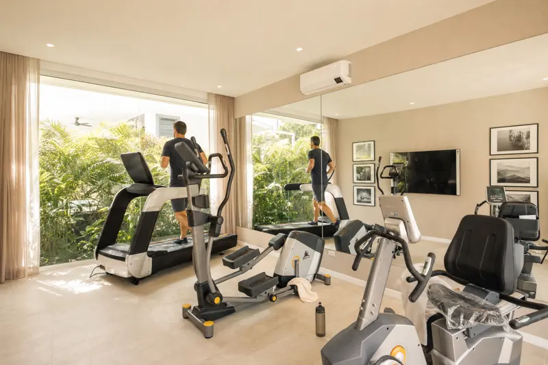 A home gym with garden views
